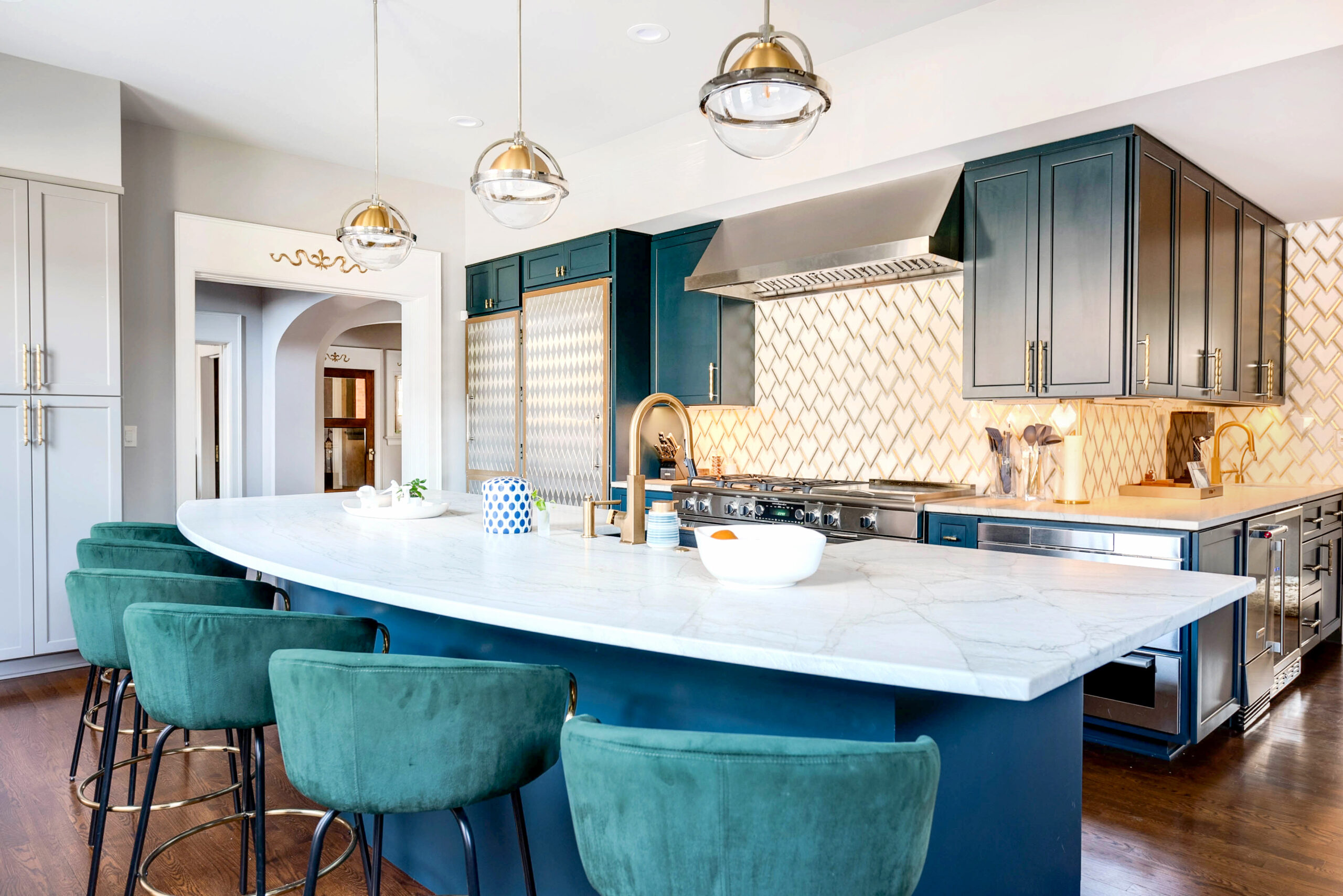 Kitchen Renovation featuring custom blue cabinetry and a rounded kitchen island.