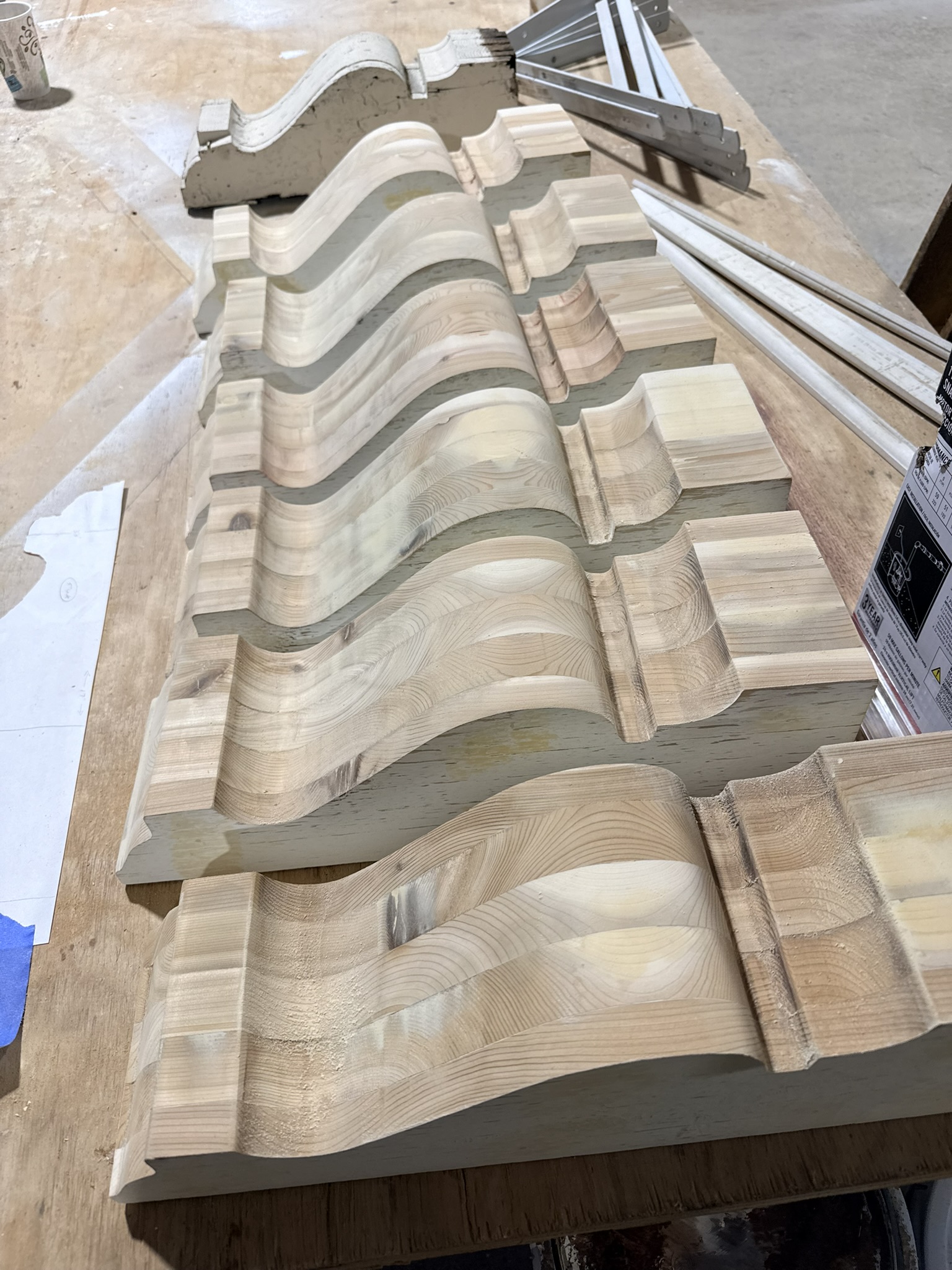 Craftsmanship making corbels for historic roof and chimney repair