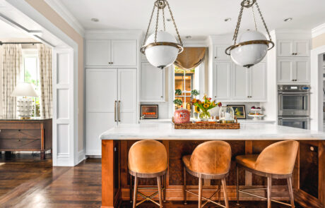 Kitchen renovation with custom kitchen island and statement white globe pendant lights.