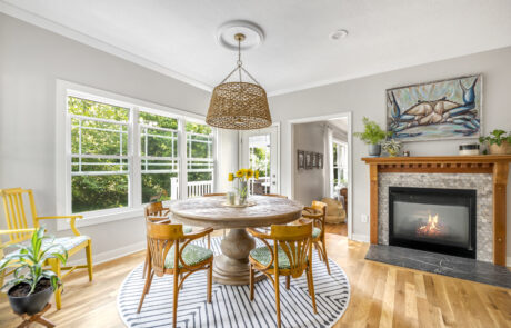 Renovated Lancaster Ohio dining area with round table and fireplace.