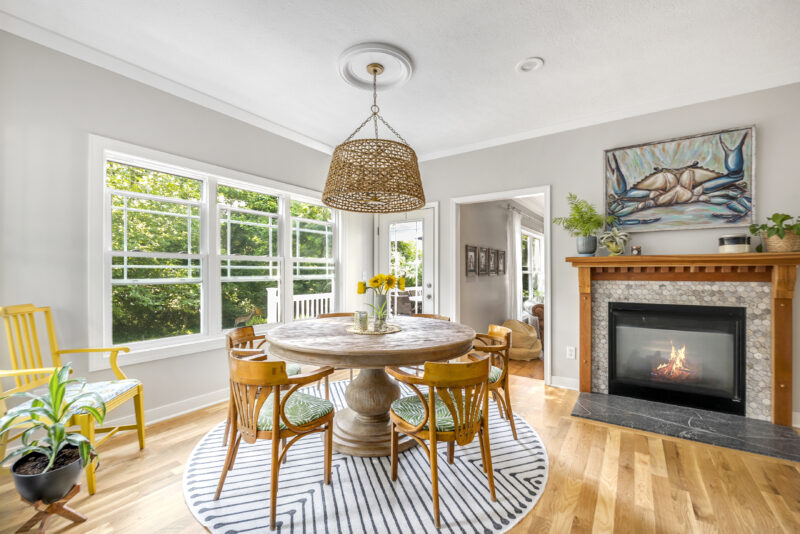 Renovated Lancaster Ohio dining area with round table and fireplace.