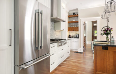 Central Ohio kitchen remodel featuring custom shelving nook and two toned custom cabinetry.