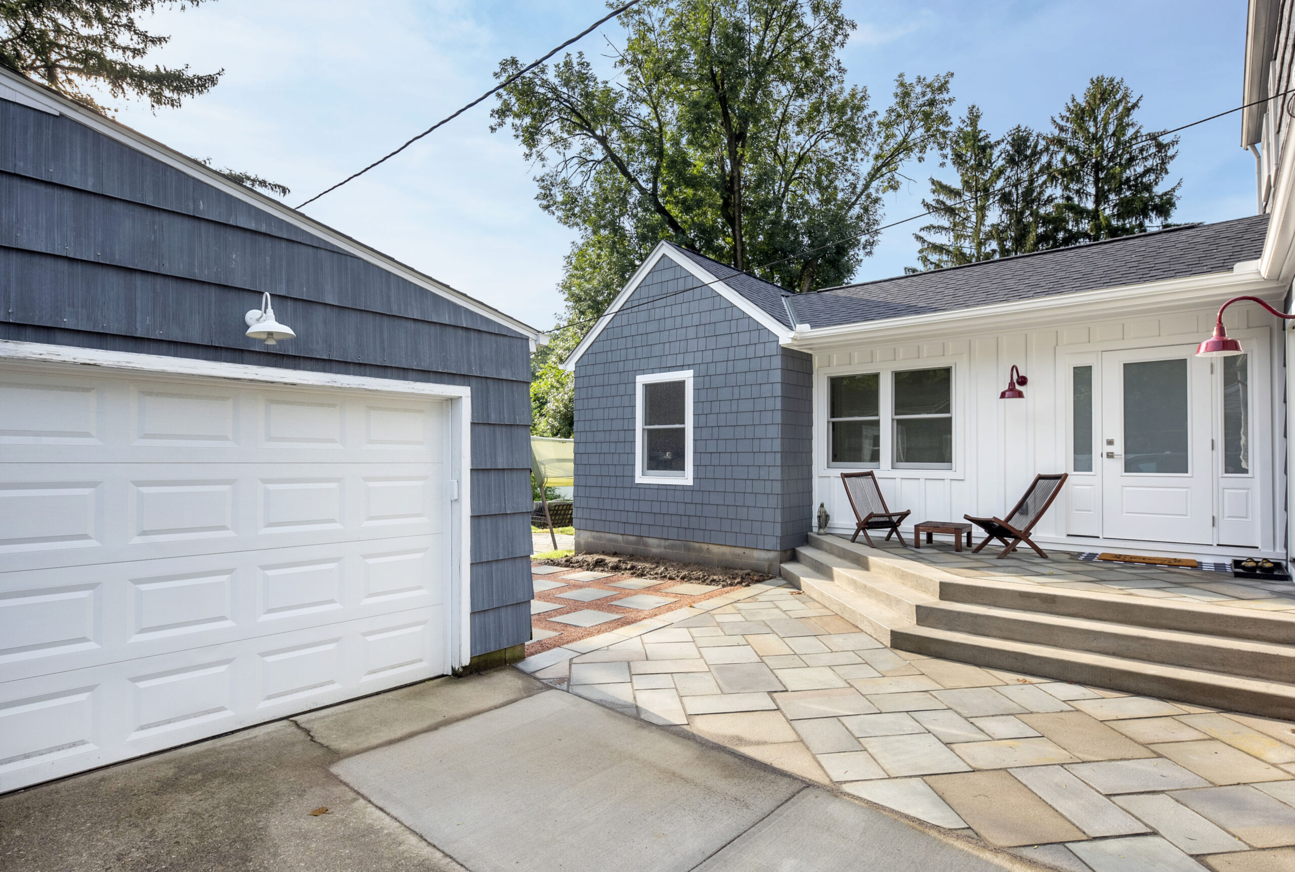 Home addition with matching garage exterior
