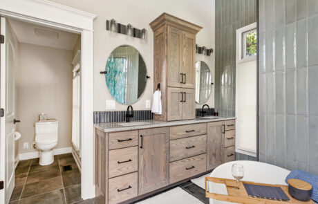 Dubling Ohio Bathroom Remodeling Large custom built double vanity with cabinetry in between the sinks