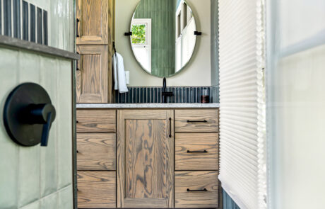 Dublin Bathroom Design Inspiration 12 Custom bath vanity with oval mirror and black finishes.