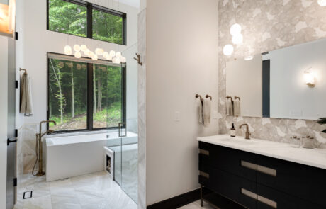 Columbus Ohio Bathroom Remodel featuring a freestanding tub in front of a large window.